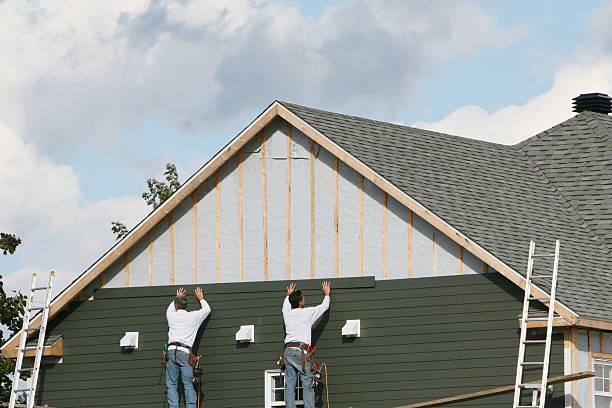 Professional Siding Contractor technician working in Walpole, MA